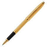 Gold pen with black clip on a white background